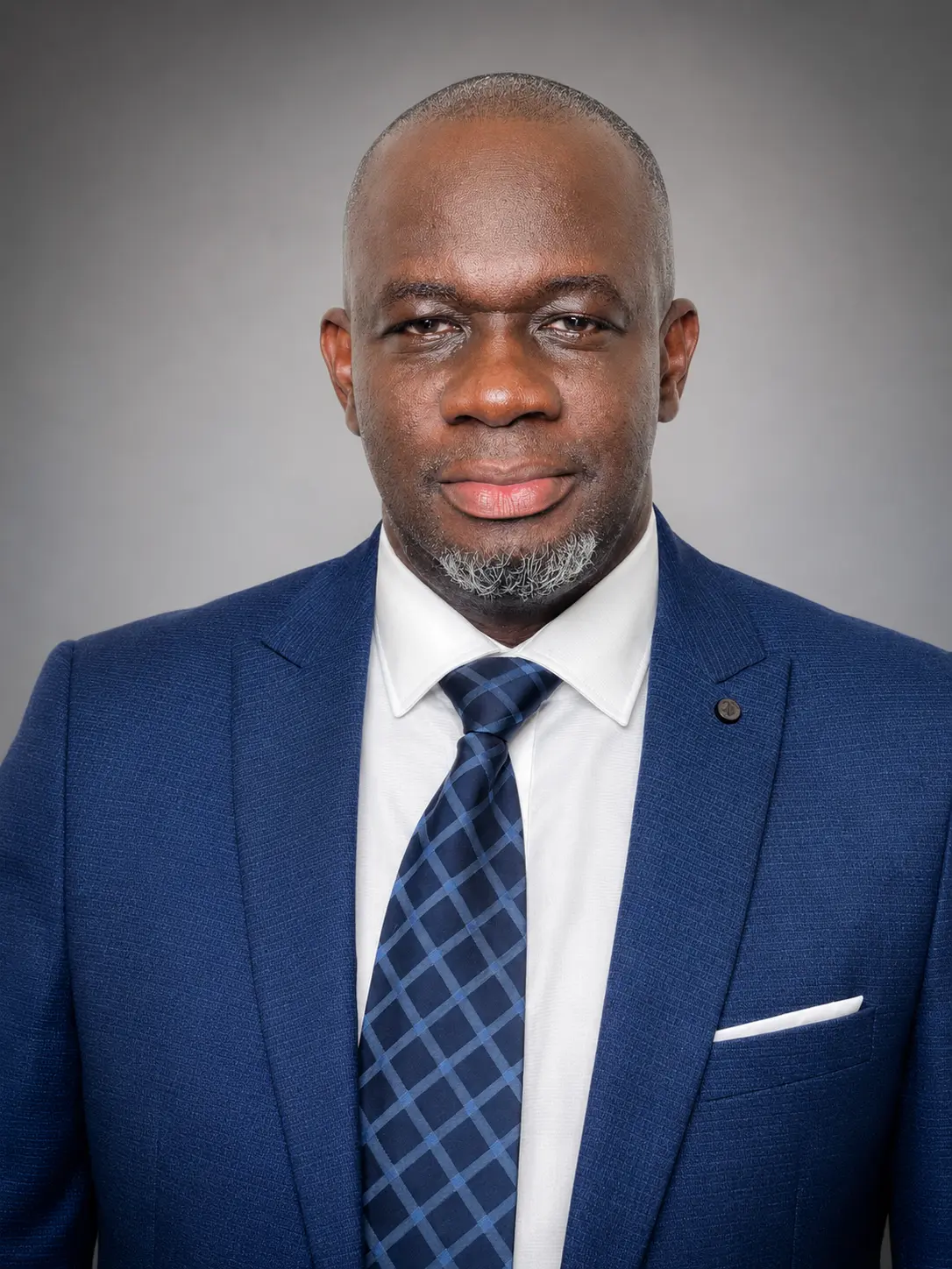 Portrait of Sorie Sulaiman Sesay in a navy suit